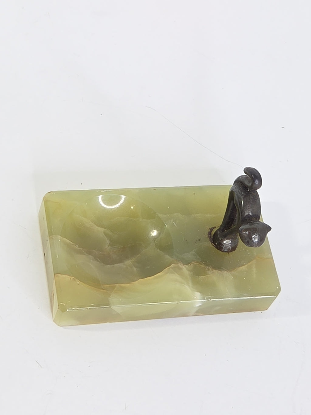 Oddly Darling Vintage green onyx trinket tray with a dark metal cat figurine in an arching pose on a white background.
