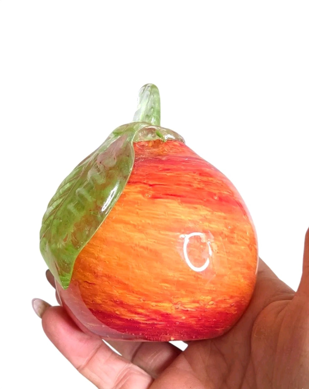 Oddly Darling Vintage hand blown glass fruit paperweight in sunset orange and red with a green glass leaf