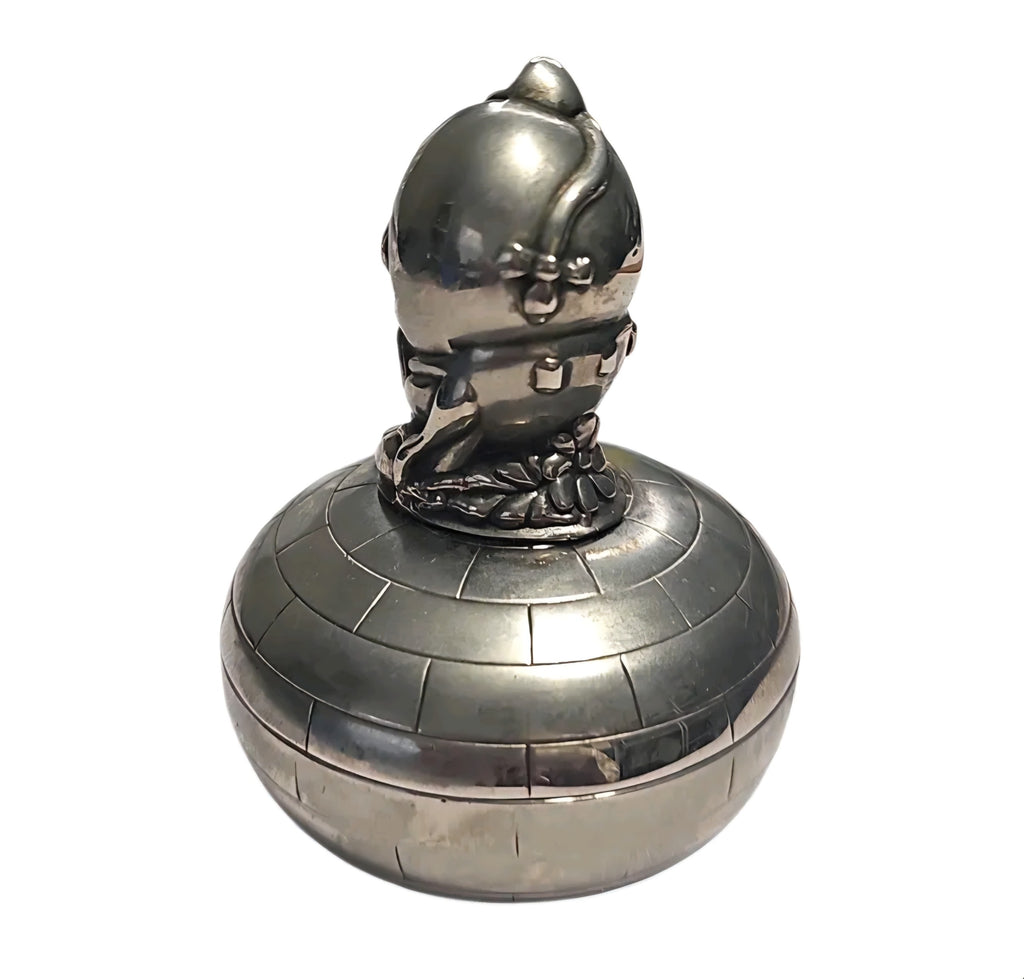 Oddly Darling Vintage silver-toned Humpty Dumpty trinket box with a textured brick-patterned base and polished finish.