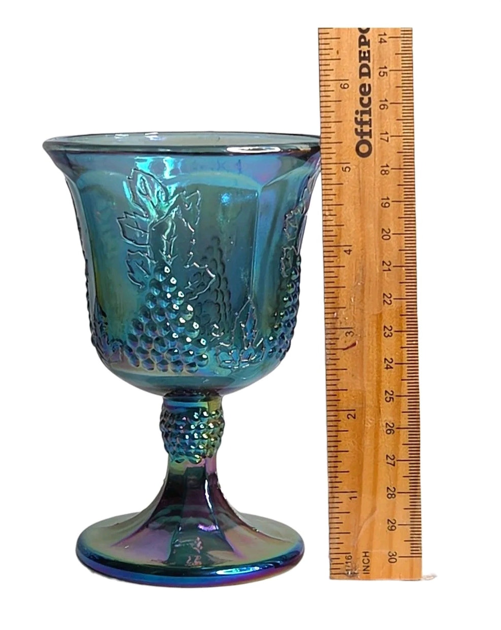 Oddly Darling Vintage iridescent blue carnival glass goblet with embossed grape and vine pattern next to a ruler.