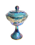 Oddly Darling Vintage iridescent blue carnival glass pedestal candy dish with embossed grape and vine motif and lid.
