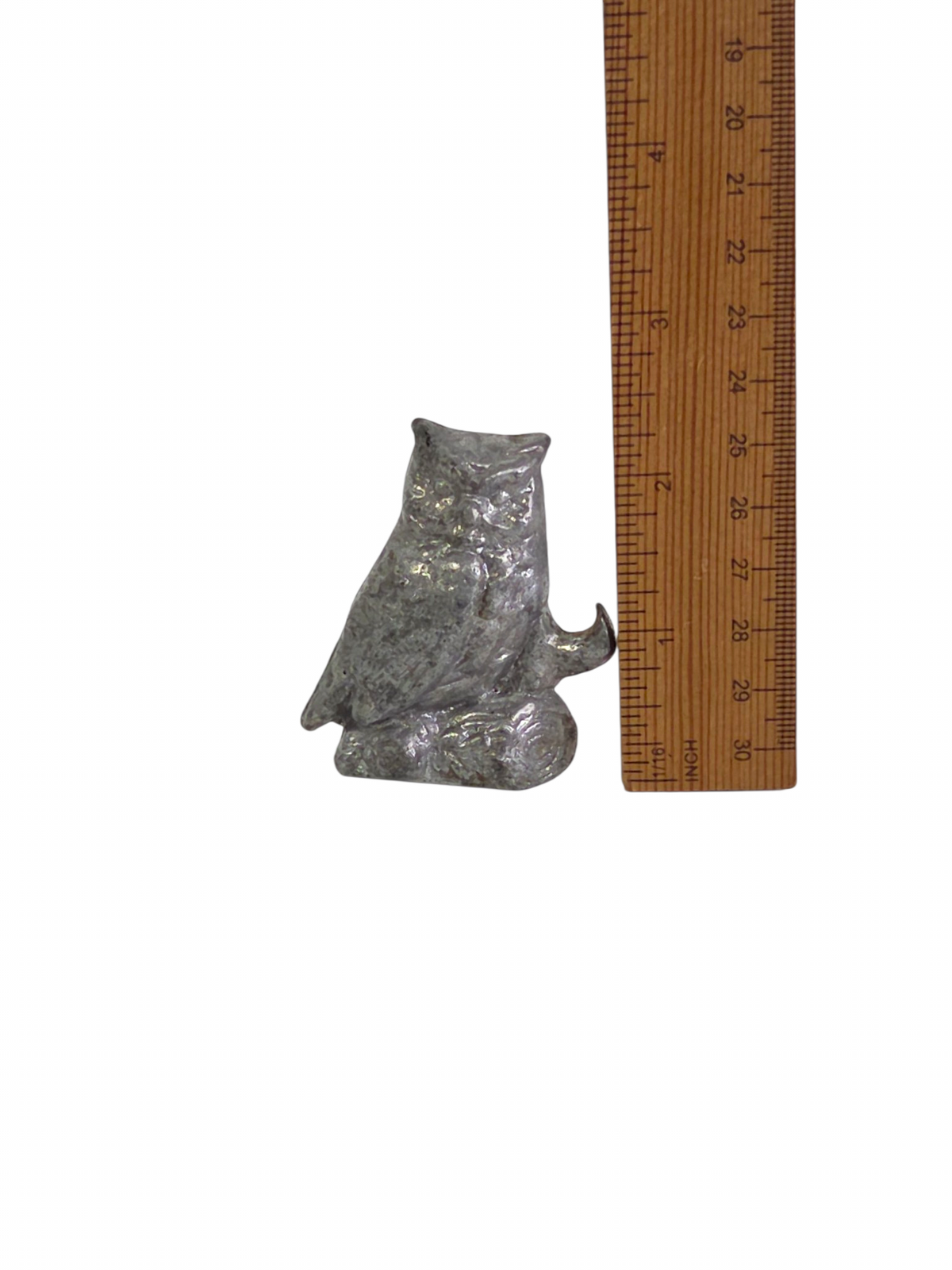 Oddly Darling Vintage 2.25 inch owl bottle opener next to a ruler for scale.