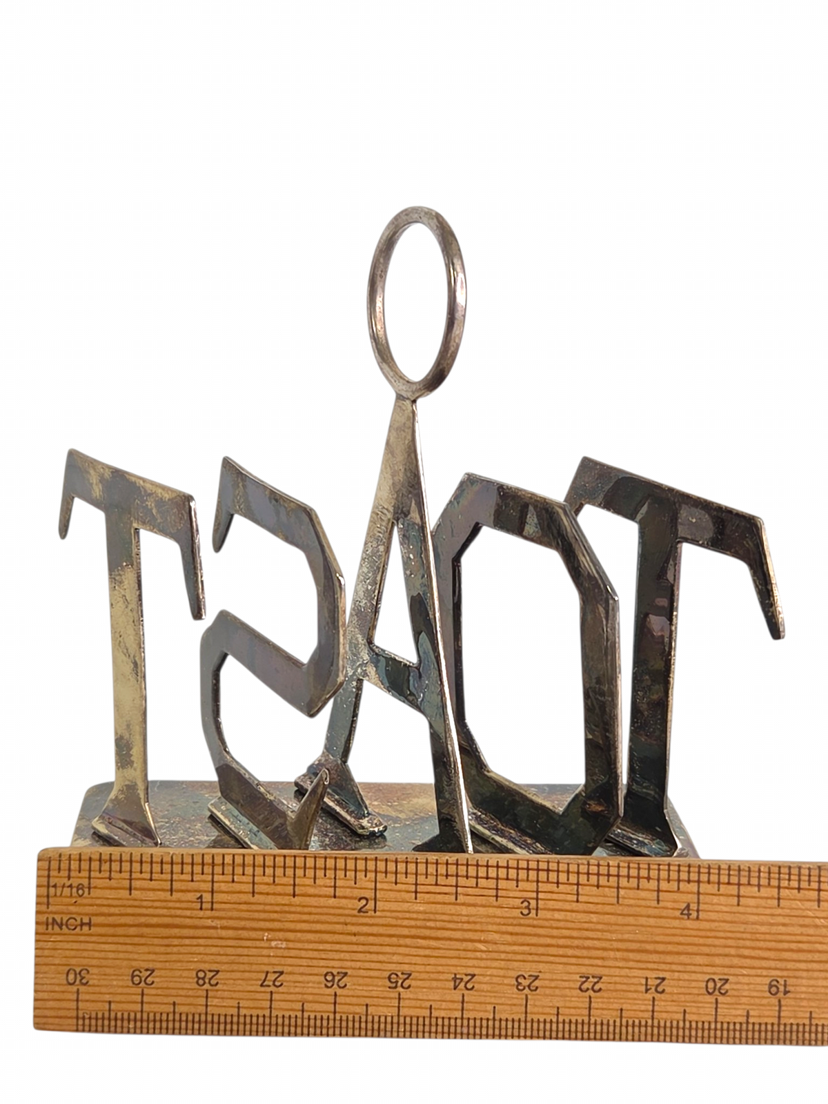 Oddly Darling Vintage metal toast rack with sculptural TOAST lettering and a central ring handle on a white background