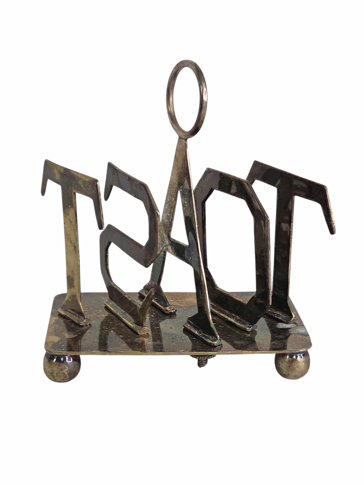 Oddly Darling Vintage metal toast rack with sculptural TOAST lettering, central ring handle, and ball feet.