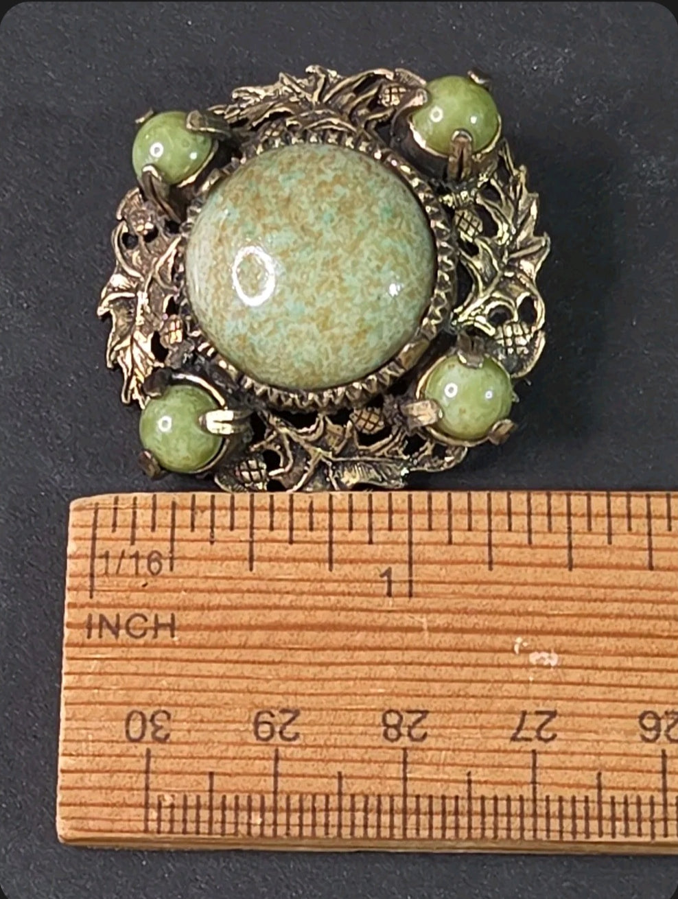 Oddly Darling Vintage Miracle brooch with sage green cabochon stones and antique gold leaf and acorn metal filigree.