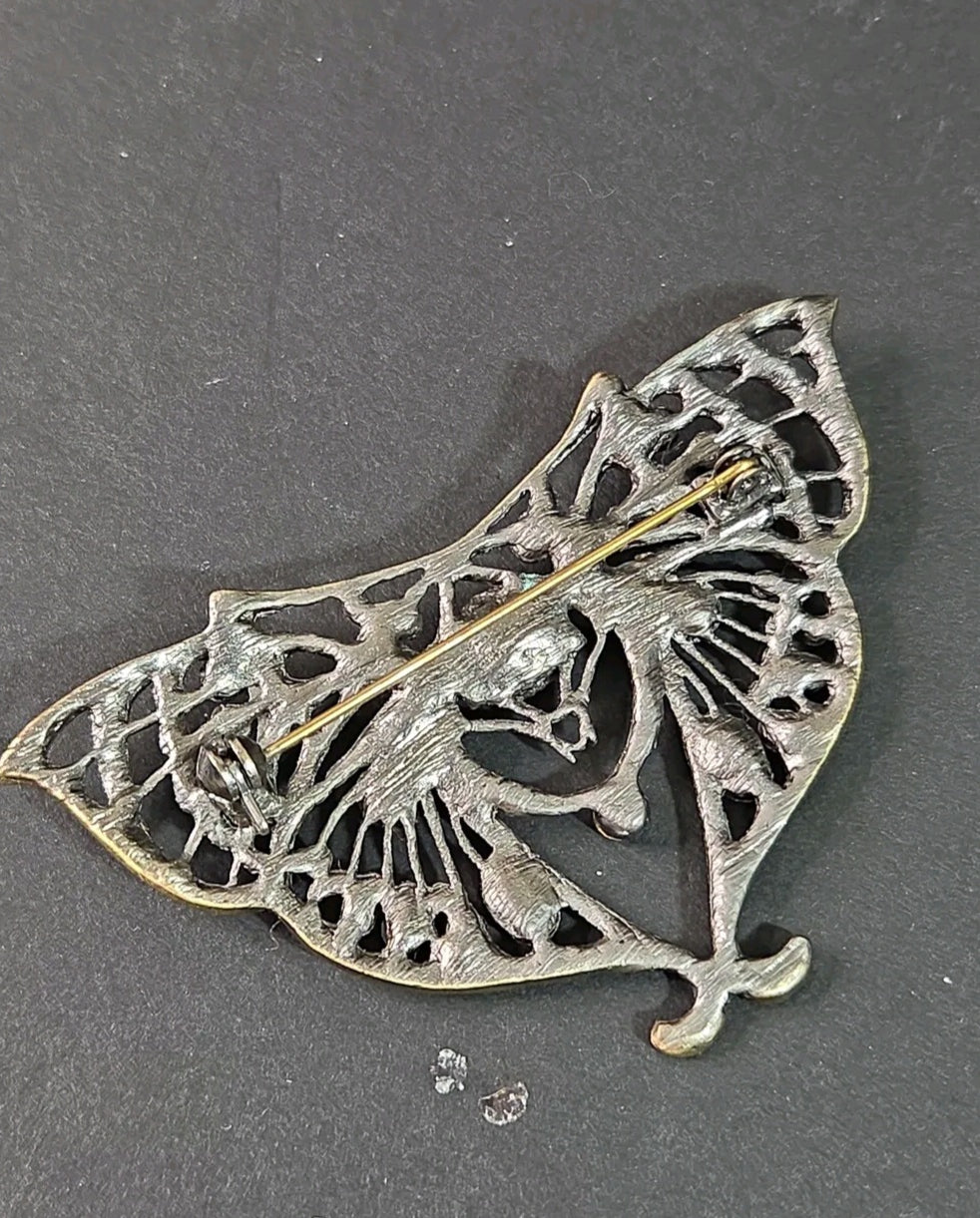 Oddly Darling Vintage ornate moth brooch back view showing the antique bronze metalwork and secure pin closure.