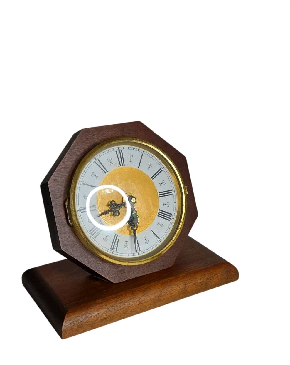 Oddly Darling Vintage octagonal wooden mantel clock with a gold-toned face, Roman numerals, and ornate black hands.