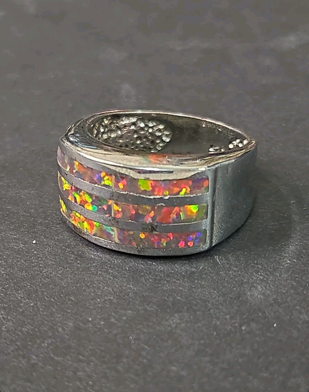 Oddly Darling Vintage wide band ring featuring three horizontal channels of iridescent multi-colored opal inlay.