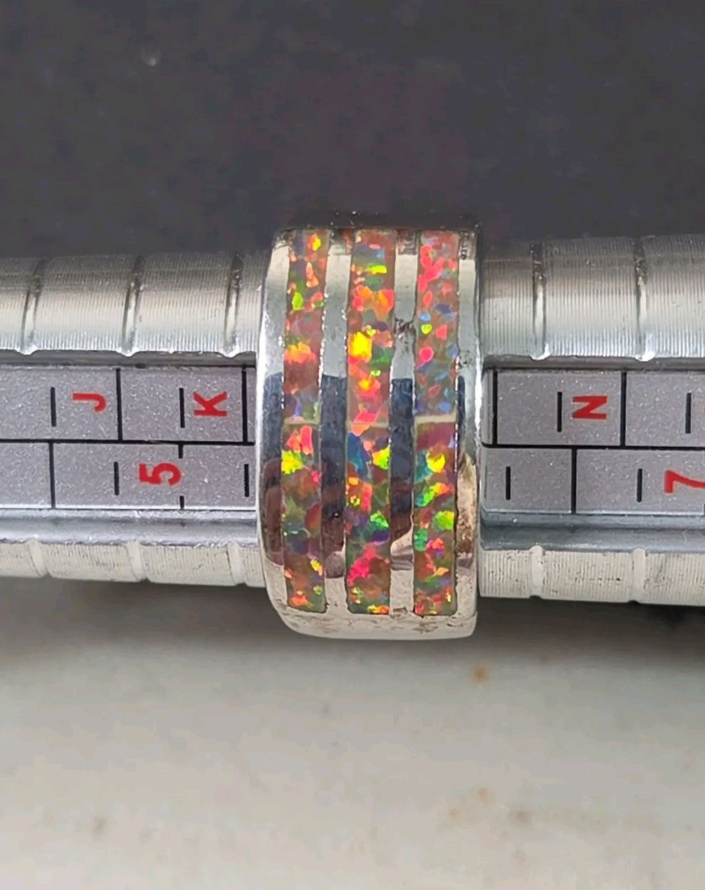 Oddly Darling Vintage wide band ring featuring three channels of iridescent multi-colored opal inlay on silver-tone