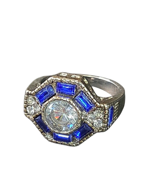 Oddly Darling Vintage ornate statement ring with a central round stone, blue baguette accents, and antique band.