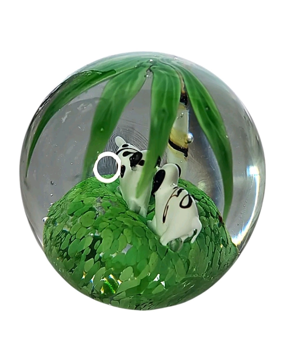 Oddly Darling Vintage handcrafted glass paperweight featuring two panda bears in a green bamboo forest scene.