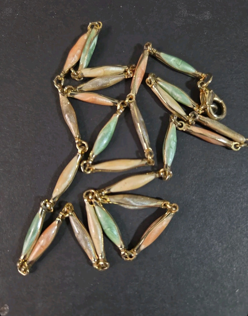 Oddly Darling Vintage necklace featuring marquise-shaped pastel sage, peach, and cream beads with gold-tone links.