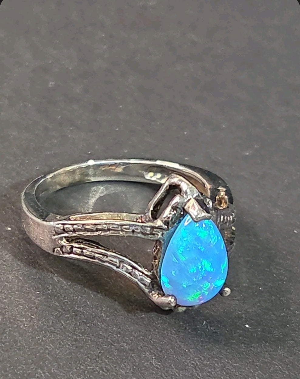 Oddly Darling Vintage pear-shaped blue opal statement ring with a textured silver-tone split-shank band.