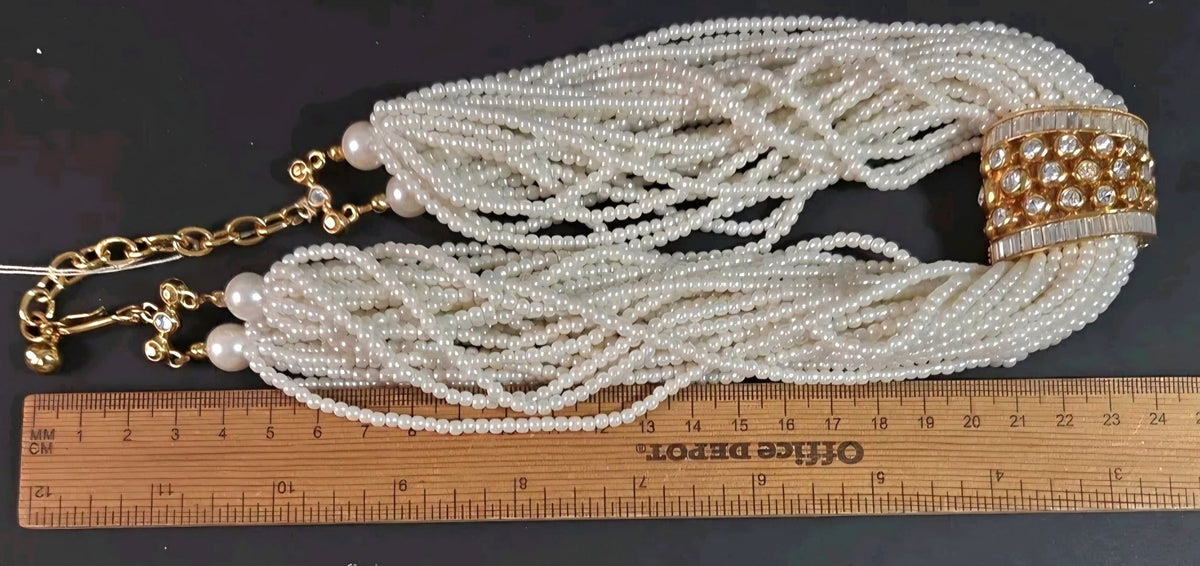 Oddly Darling Vintage multi-strand cream faux pearl necklace with a gold-tone rhinestone centerpiece and ruler scale.