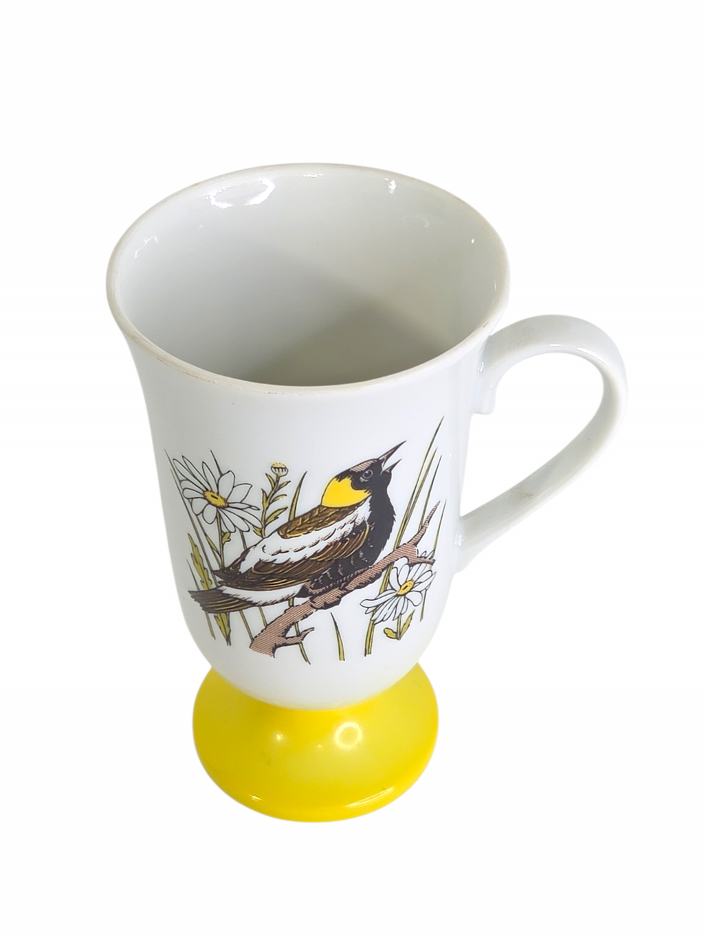 Oddly Darling Vintage pedestal mug featuring a songbird and daisy illustration with a bright yellow base