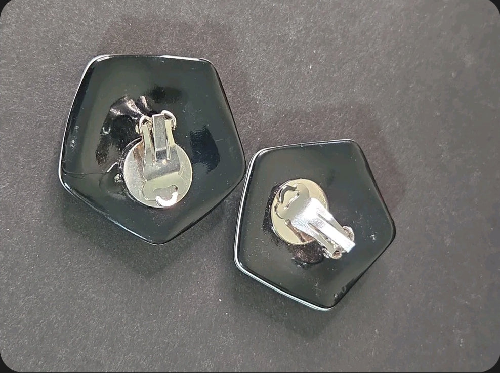 Oddly Darling Vintage pentagonal clip-on earrings with a glossy black finish and silver-tone metal backings
