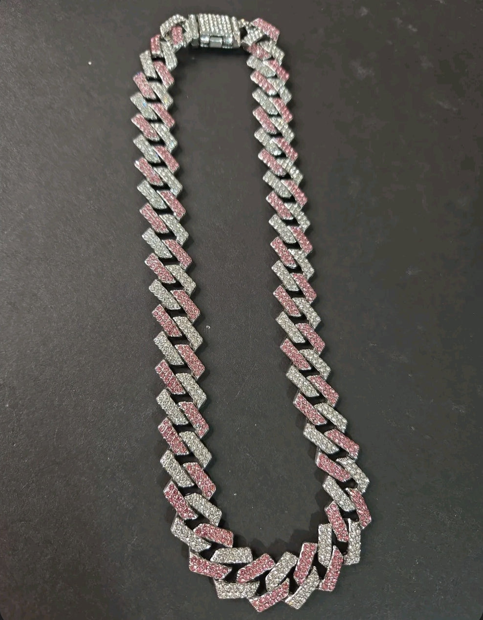 Oddly Darling Vintage iced-out cuban link necklace with alternating clear and pink crystal stones on a heavy chain.