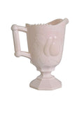 Oddly Darling Vintage pale pink milk glass creamer pitcher with an embossed pear design and pedestal base.