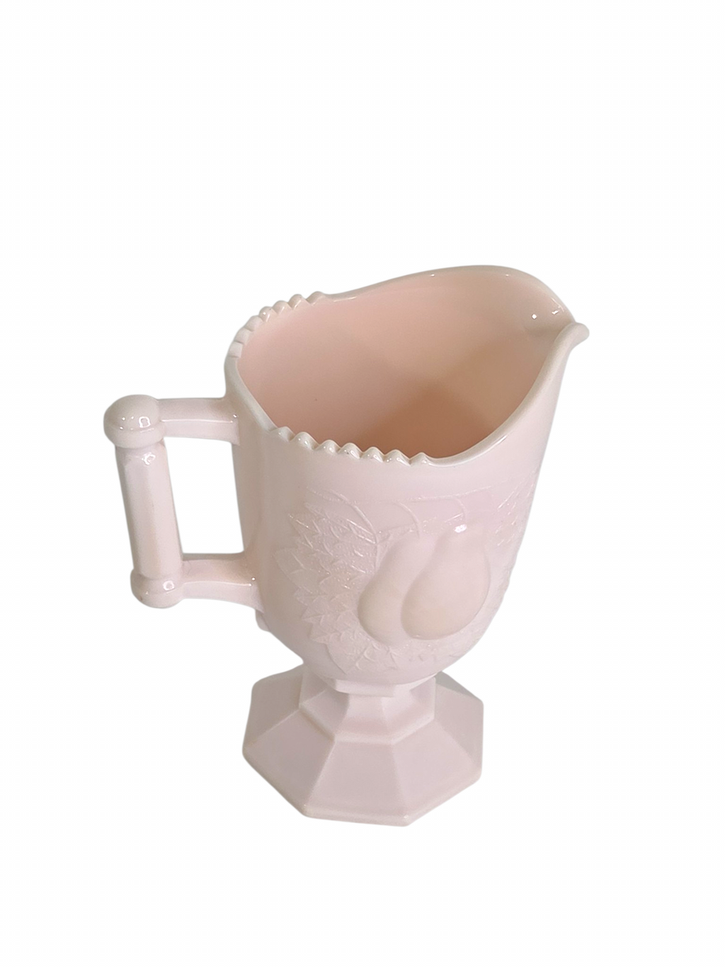 Oddly Darling Vintage pale pink milk glass creamer pitcher with an embossed pear design and pedestal base.