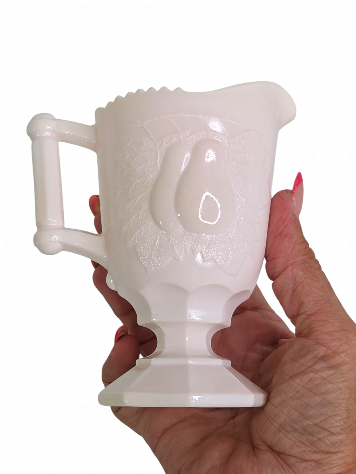 Oddly Darling Vintage pale pink milk glass creamer pitcher with an embossed pear design and pedestal base.
