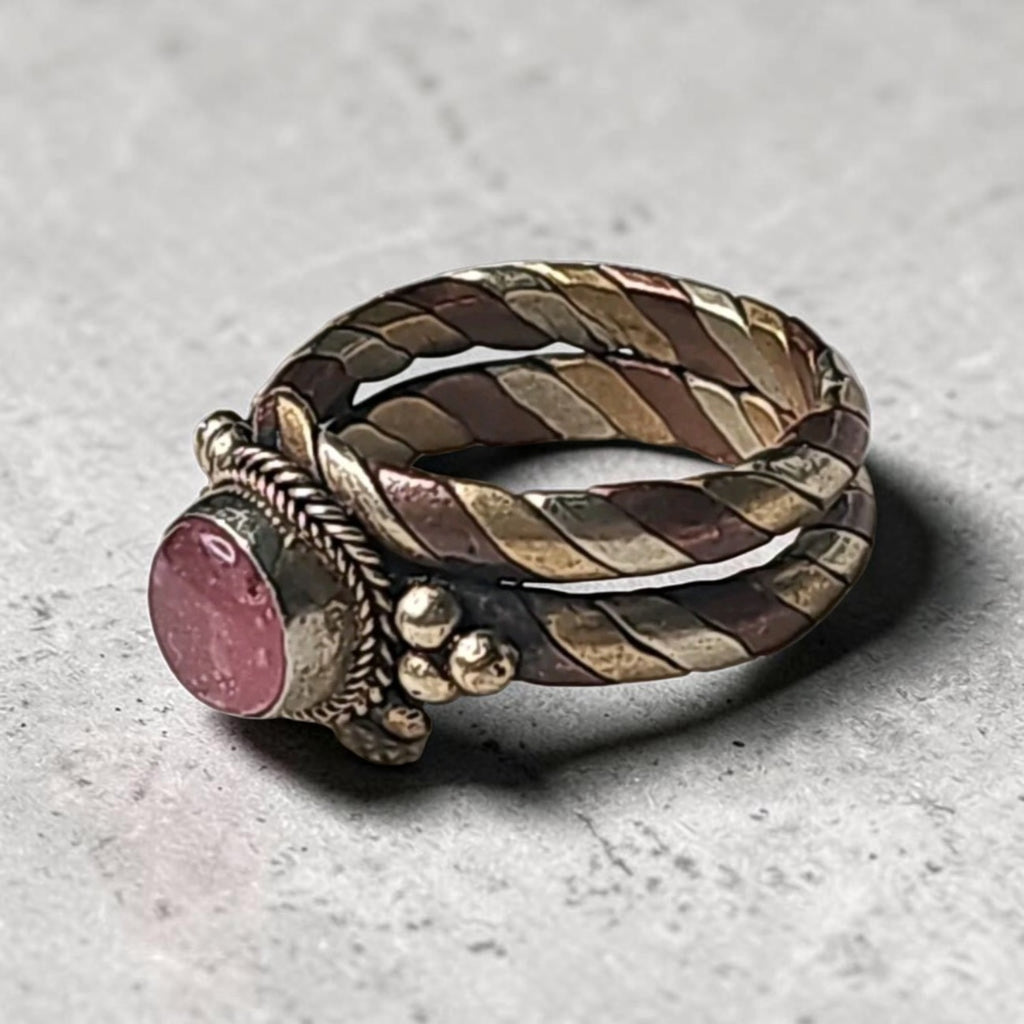 Oddly Darling Vintage twisted metal band ring featuring a pink cabochon stone with copper and brass rope detailing.