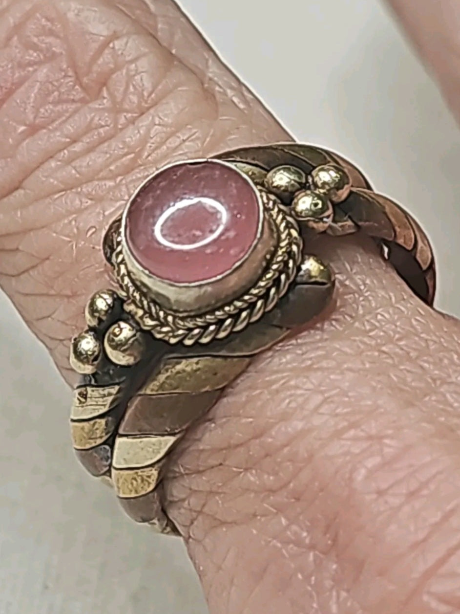 Oddly Darling Vintage twisted metal band ring featuring a pink cabochon stone with rope and bead detailing.