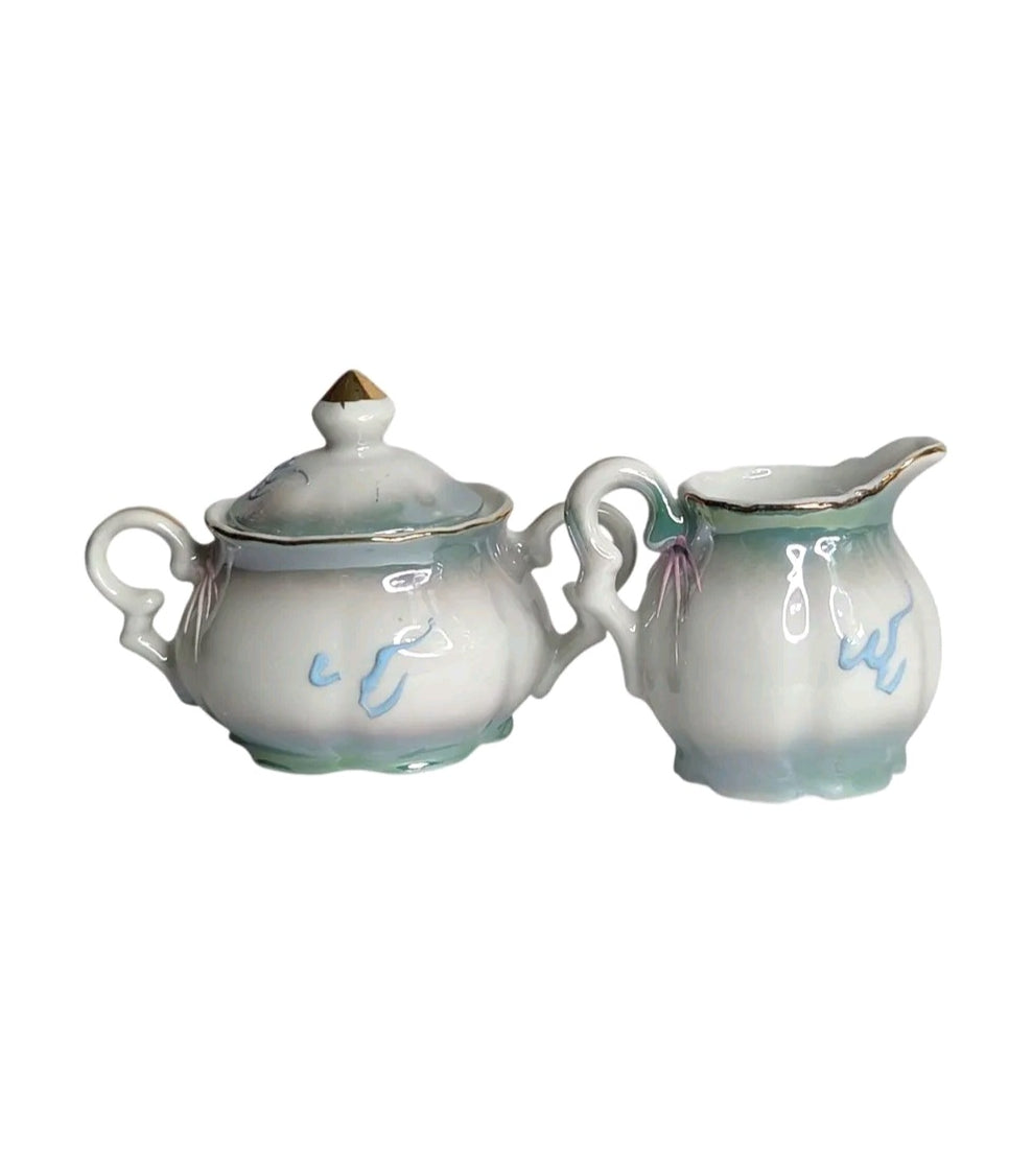 Oddly Darling Vintage porcelain creamer and sugar bowl set with iridescent finish, gold trim, and Rock City graphic.