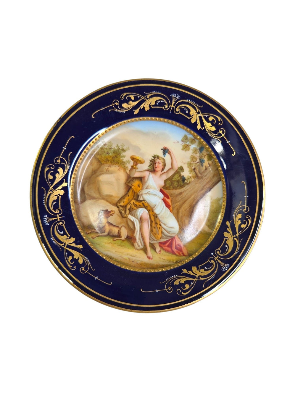 Oddly Darling Vintage porcelain display plate featuring a hand-painted mythological scene with gold-gilt cobalt border