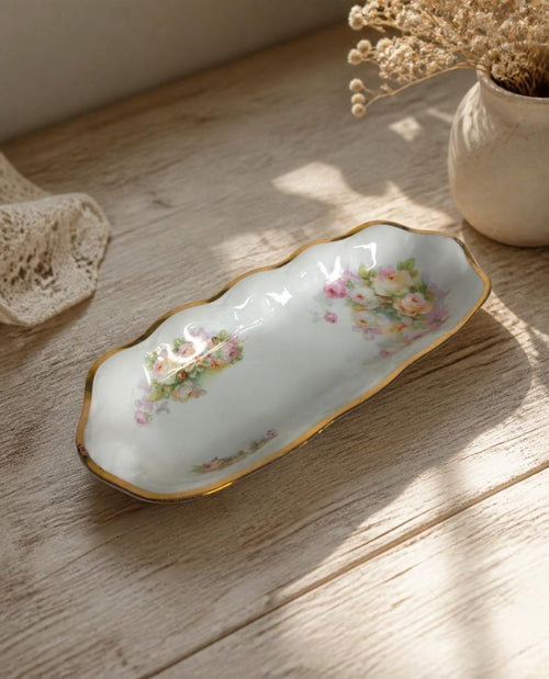 Oddly Darling Vintage porcelain serving tray with hand-painted floral motifs, scalloped edges, and a gold-gilded rim.