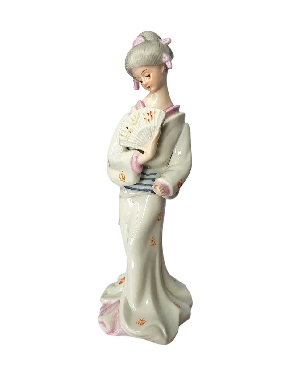 Oddly Darling Vintage porcelain geisha figurine wearing a white kimono with hand-painted details and holding a fan.