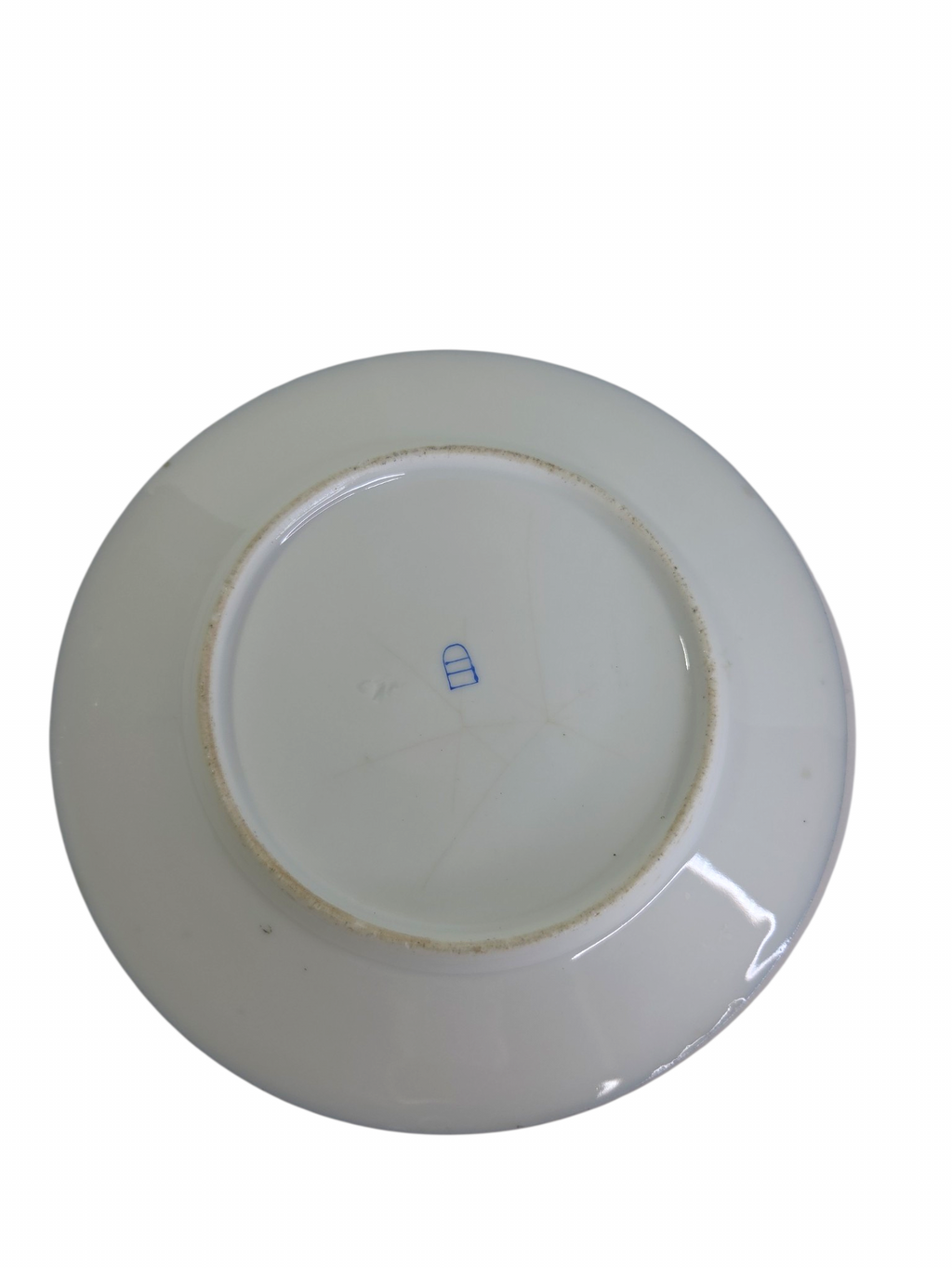 Oddly Darling Vintage porcelain display plate underside showing a blue maker mark on a white ceramic base