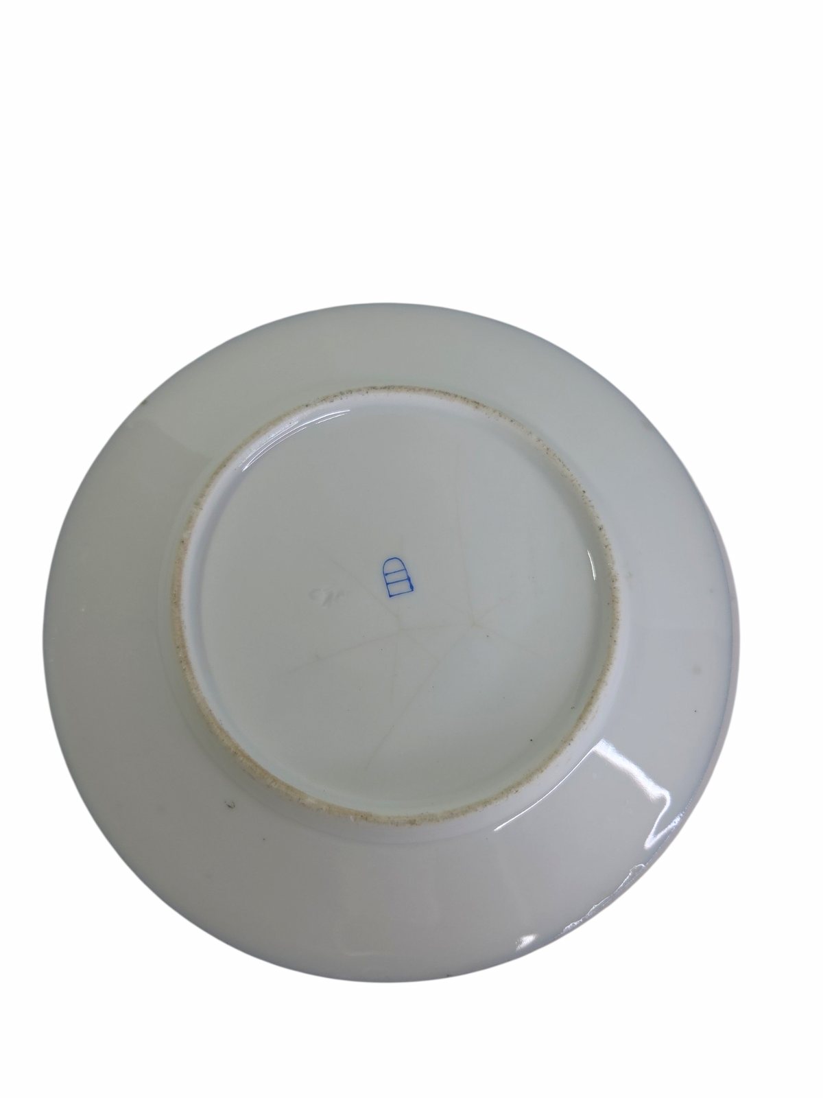 Oddly Darling Vintage porcelain display plate underside showing a blue maker mark on a white ceramic base