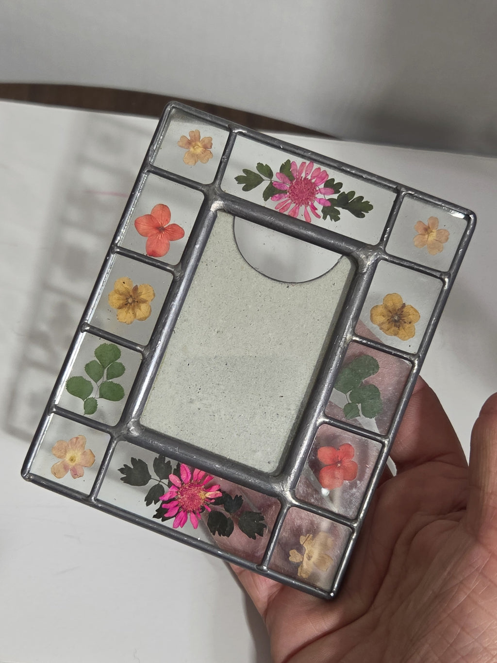 Oddly Darling Vintage stained-glass picture frame featuring real pressed pink, yellow, and orange flowers and greenery.