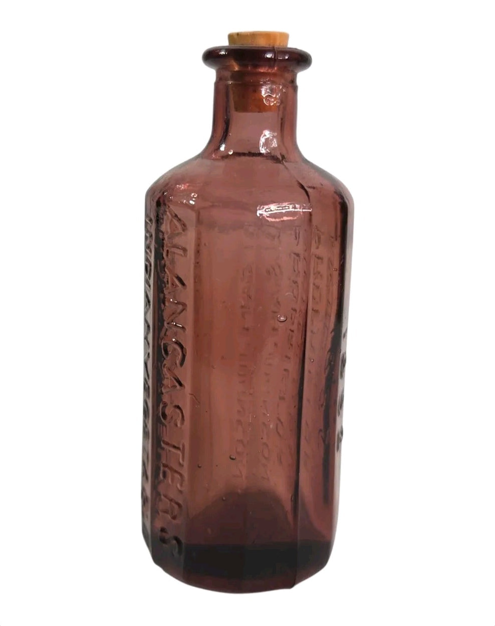 Oddly Darling Vintage purple glass apothecary bottle with embossed Lancaster's text and a cork stopper.