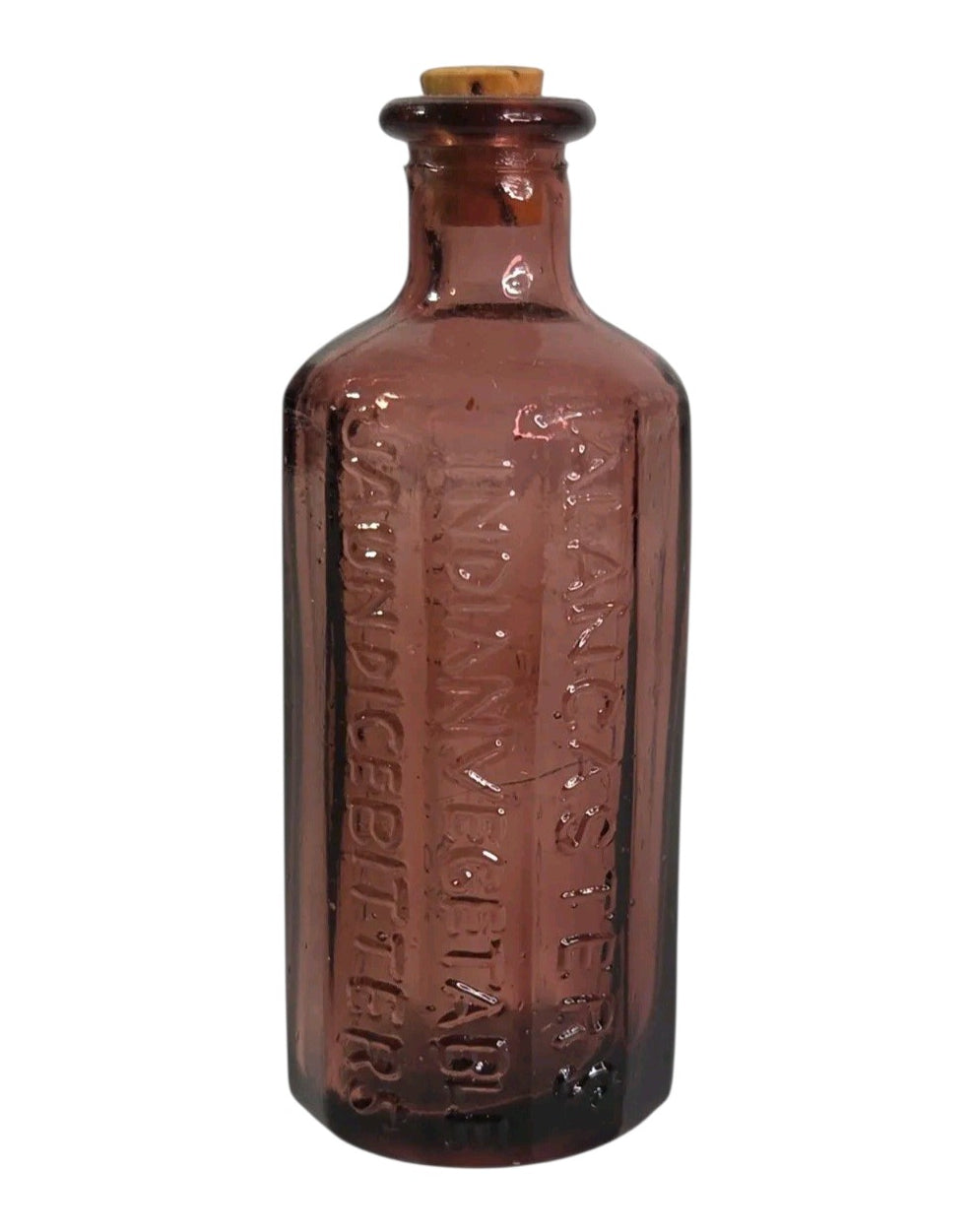 Oddly Darling Vintage purple embossed glass apothecary bottle with cork stopper and antique medicine label text.