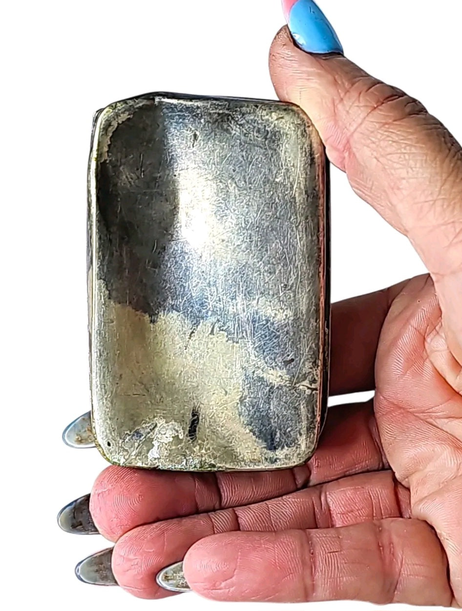 Oddly Darling Vintage R. Wallace & Sons silver-soldered trinket box with aged patina held in a hand