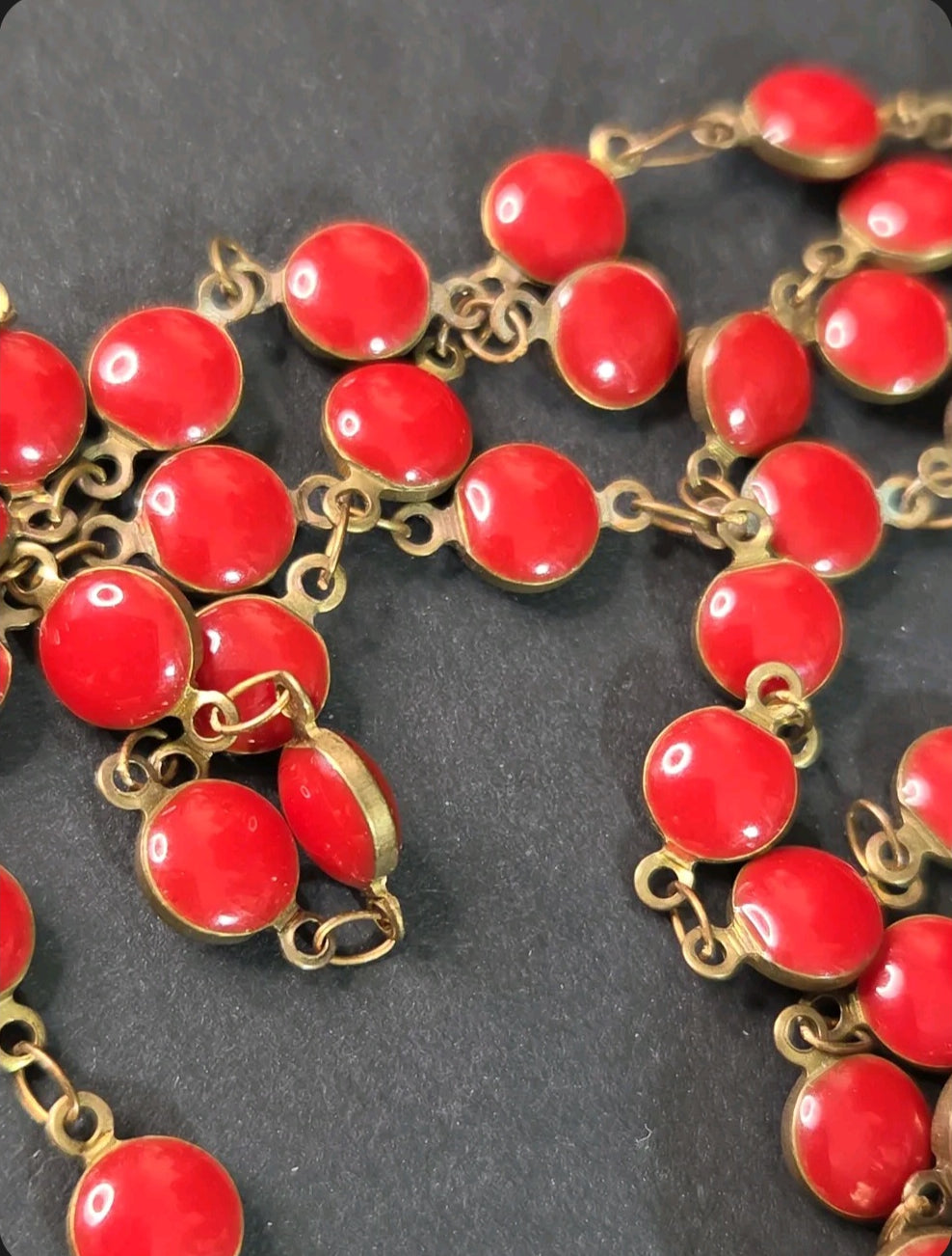 Oddly Darling Vintage long necklace featuring vibrant red circular enamel beads linked with gold-tone metal hardware.