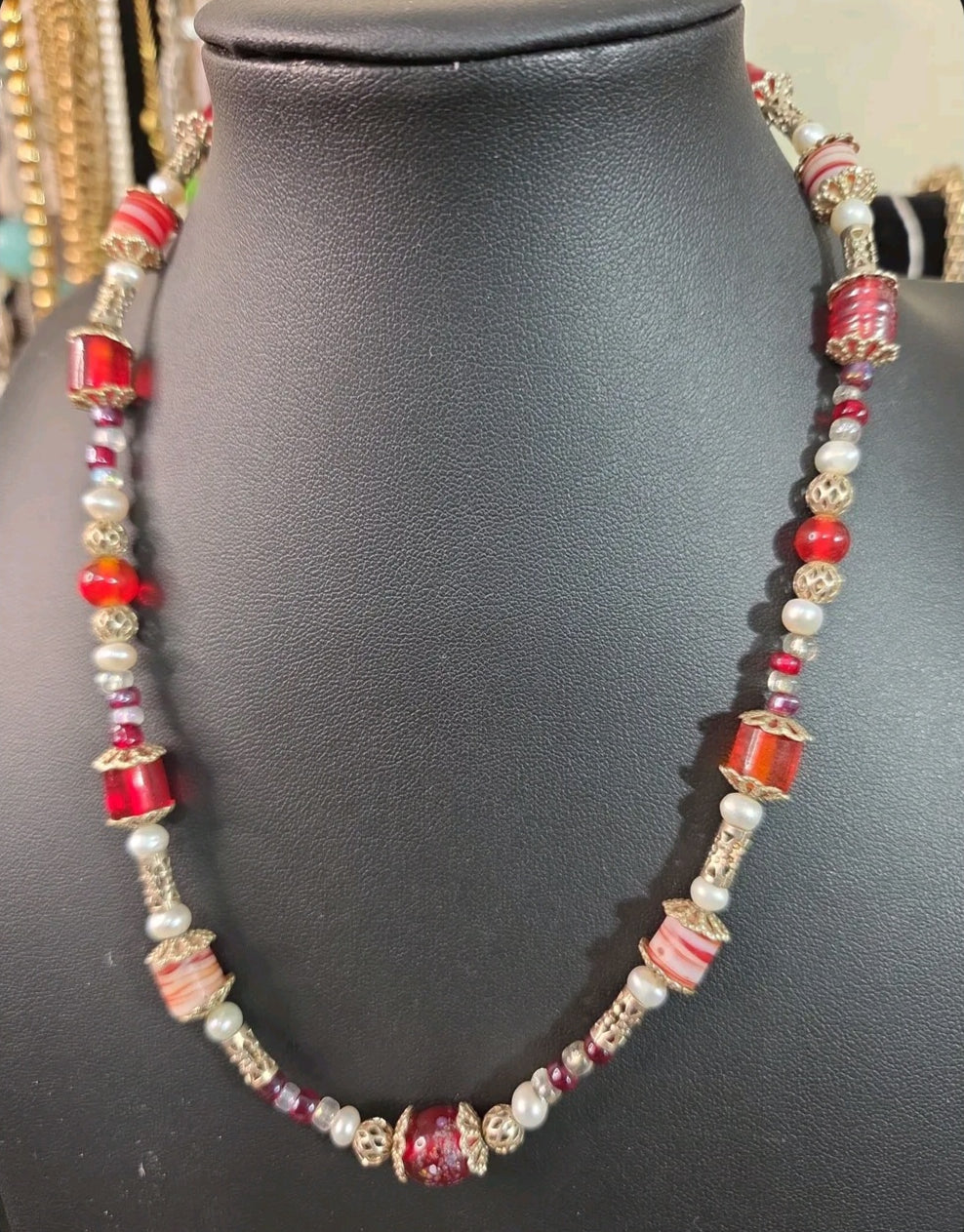 Oddly Darling Vintage statement necklace featuring crimson red glass beads, white pearls, and gold-tone filigree spacers.