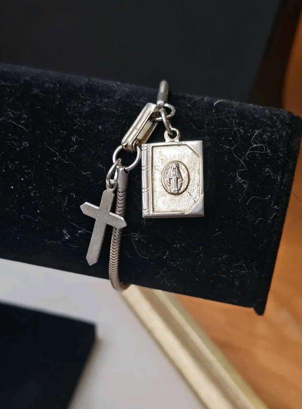 Oddly Darling Vintage silver-tone snake chain bracelet featuring a minimalist cross and an opening religious book charm.