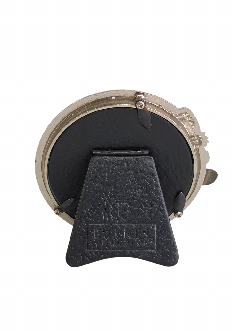 Back view of a round Oddly Darling Vintage Burnes of Boston picture frame with a black easel stand