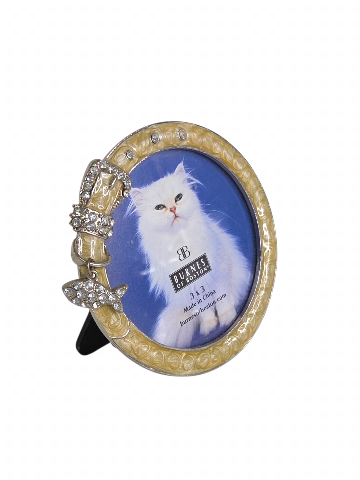Oddly Darling Vintage cream pearl enamel cat collar picture frame with rhinestone buckle, tabletop view.