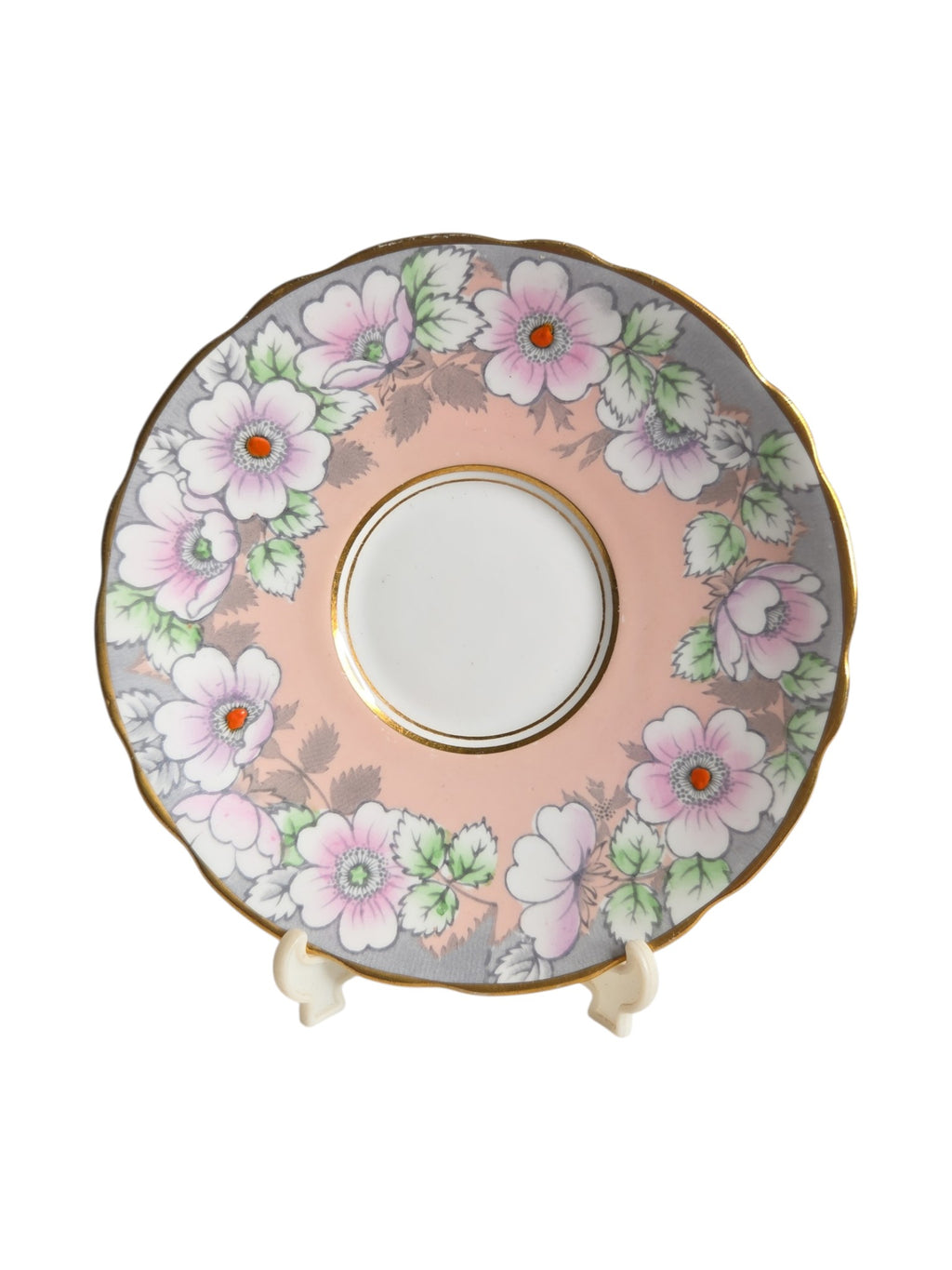 Oddly Darling Vintage Royal Stafford saucer featuring a peachy pink dogwood floral pattern with gold scalloped edges.