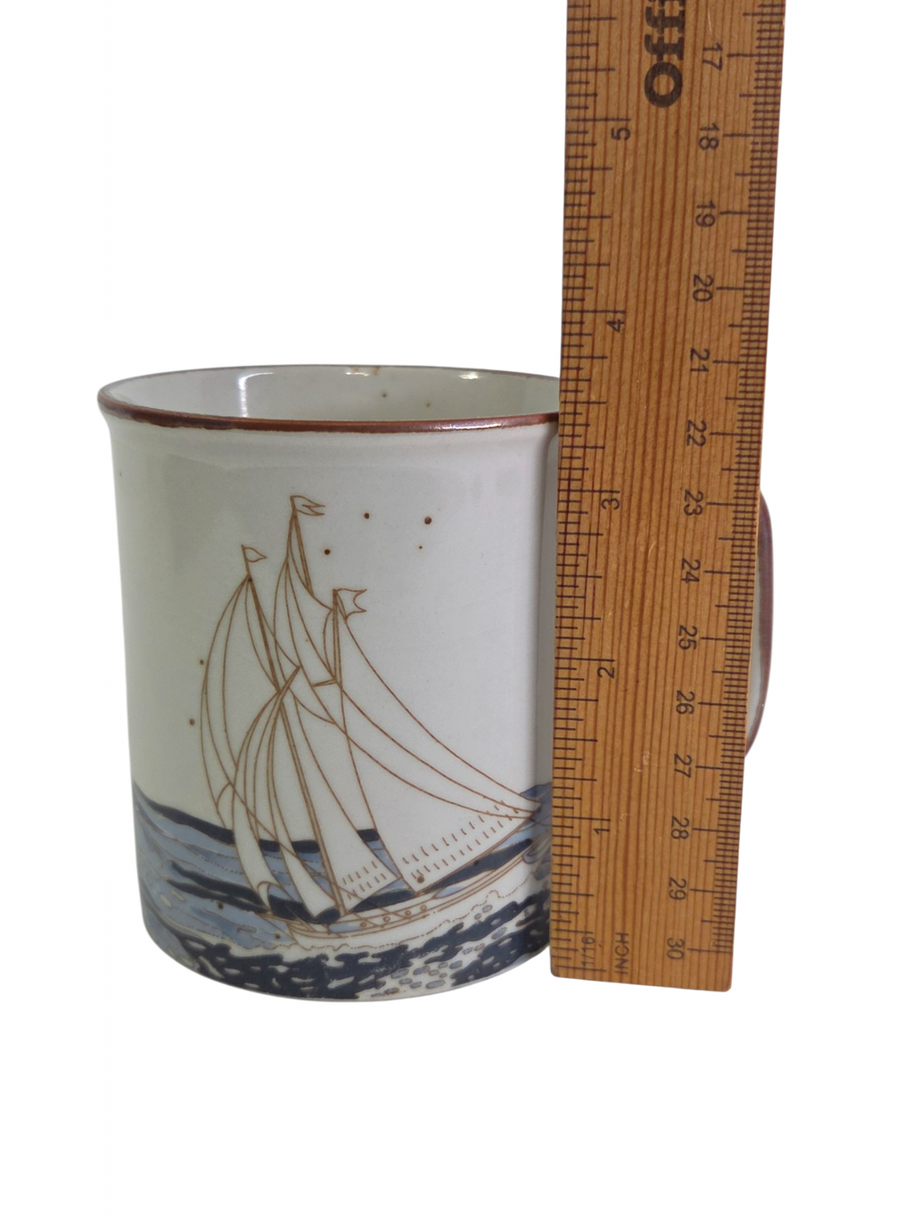 Oddly Darling Vintage ceramic coffee mug with a sailboat illustration, speckled off-white finish, and brown rim.