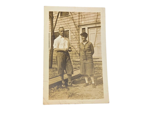 Oddly Darling Vintage original sepia-toned photograph of a couple posing outdoors in front of a house.