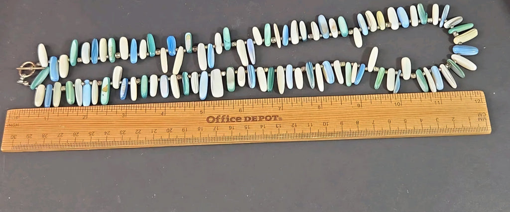 Oddly Darling Vintage multi-colored shell bead necklace with ocean blue, green, and white elongated beads and toggle
