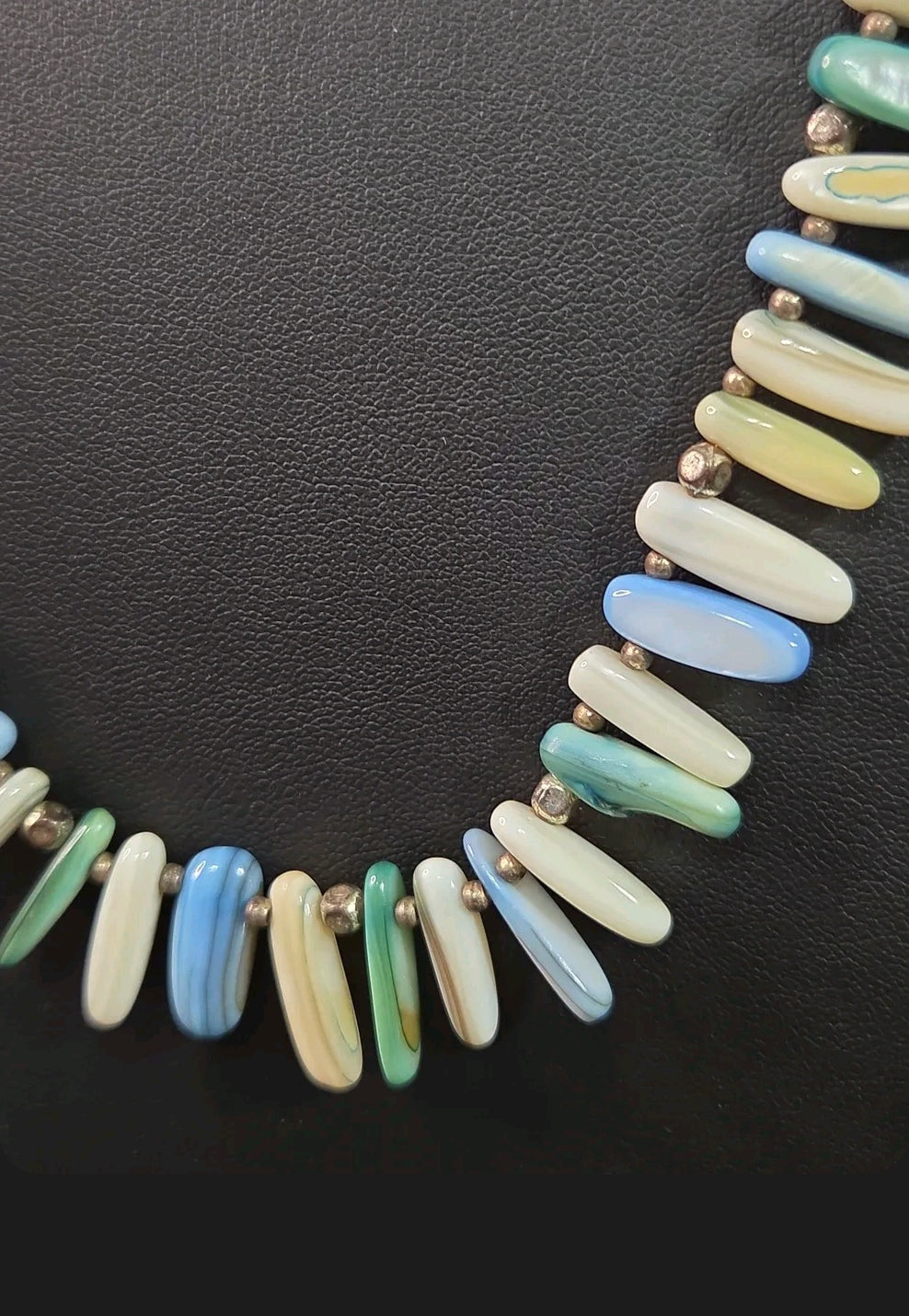 Oddly Darling Vintage statement necklace featuring elongated shell beads in ocean blue, green, and white with spacers.