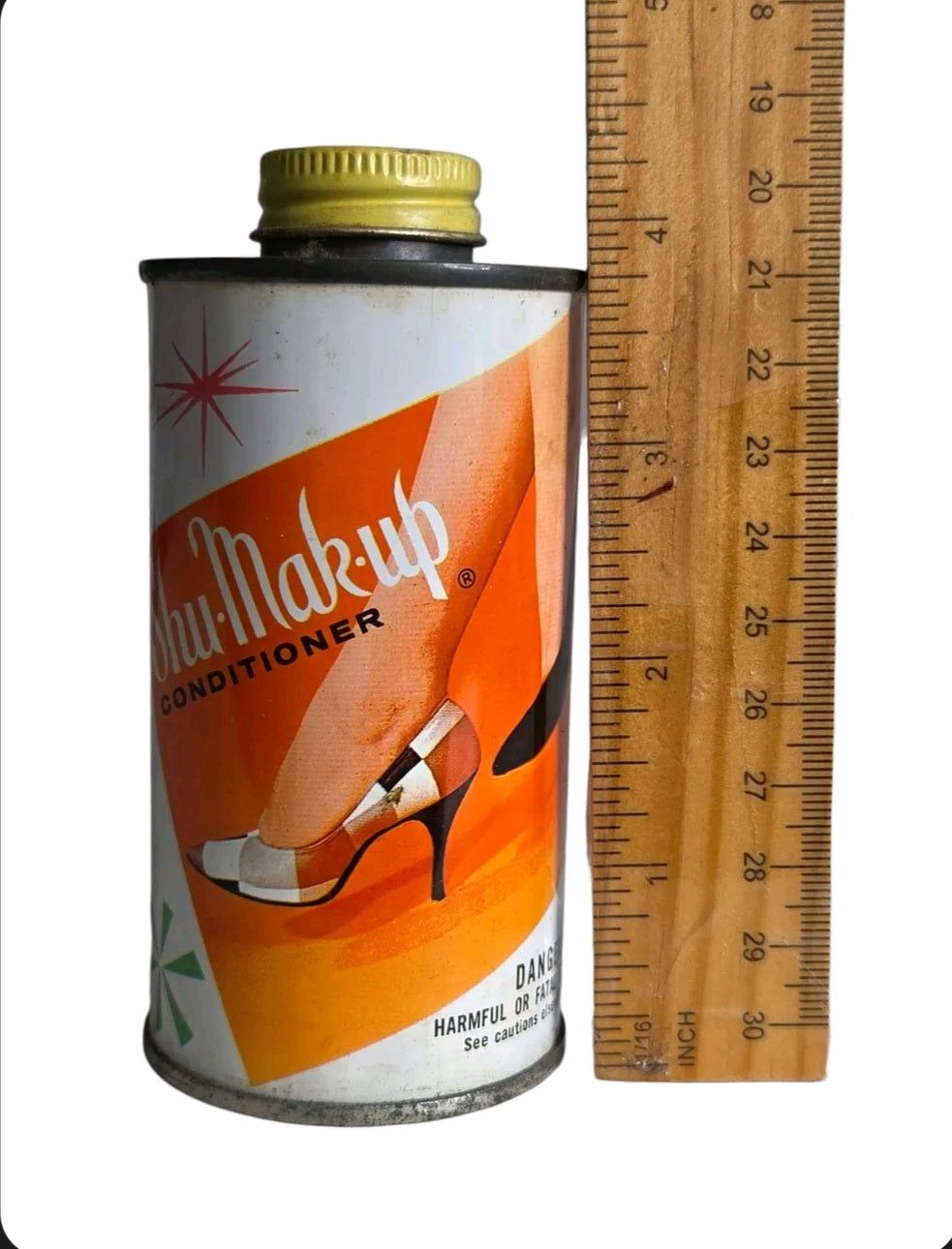 Oddly Darling Vintage Shu-Mak-Up shoe conditioner tin with 1950s orange graphic design and yellow cap next to a ruler