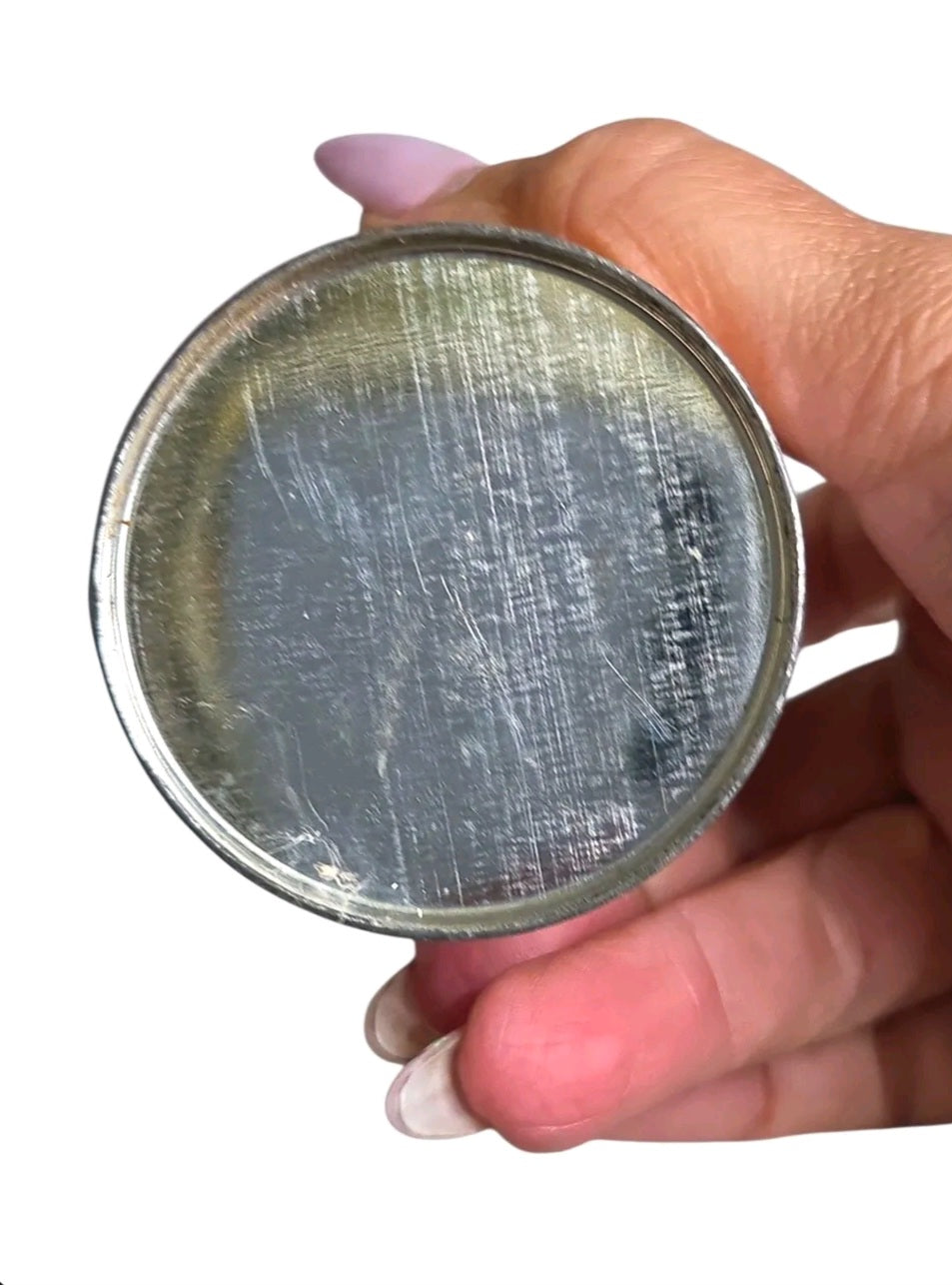 Oddly Darling Vintage Shu-Mak-Up shoe conditioner tin base showing aged metal patina held in a hand
