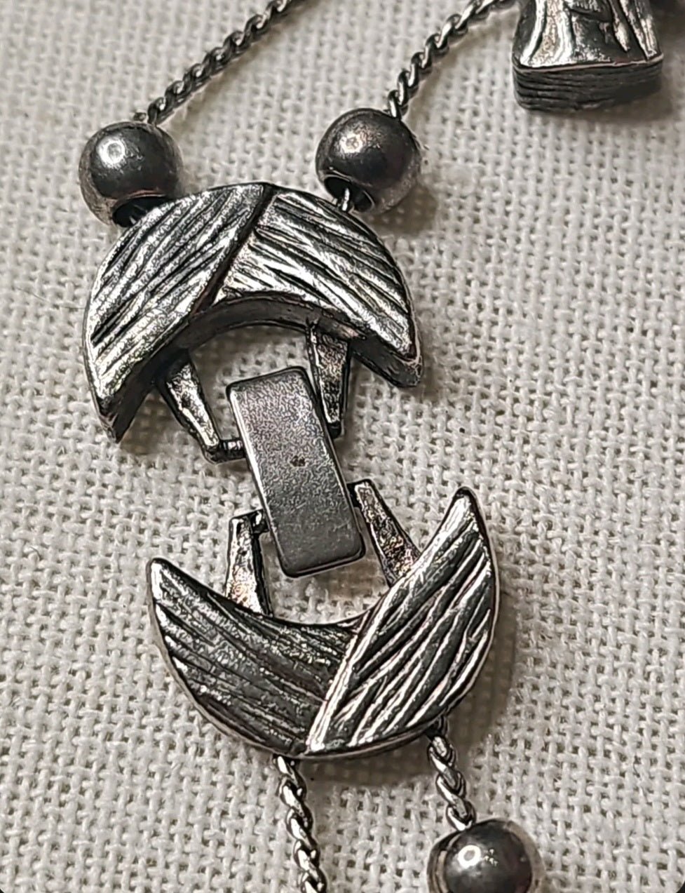 Oddly Darling Vintage silver-tone charm bracelet featuring textured crescent-shaped links and metallic beads