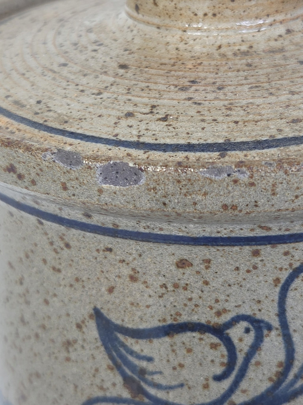 Oddly Darling Vintage speckled stoneware kitchen crock with a blue bird motif and lid in a rustic farmhouse style.